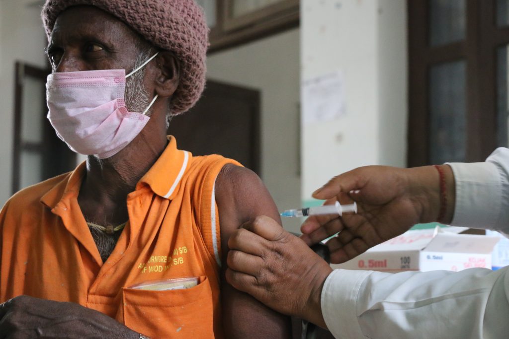 nepali man receives covid vaccine